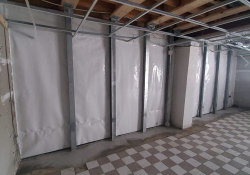 basement waterproofing in process